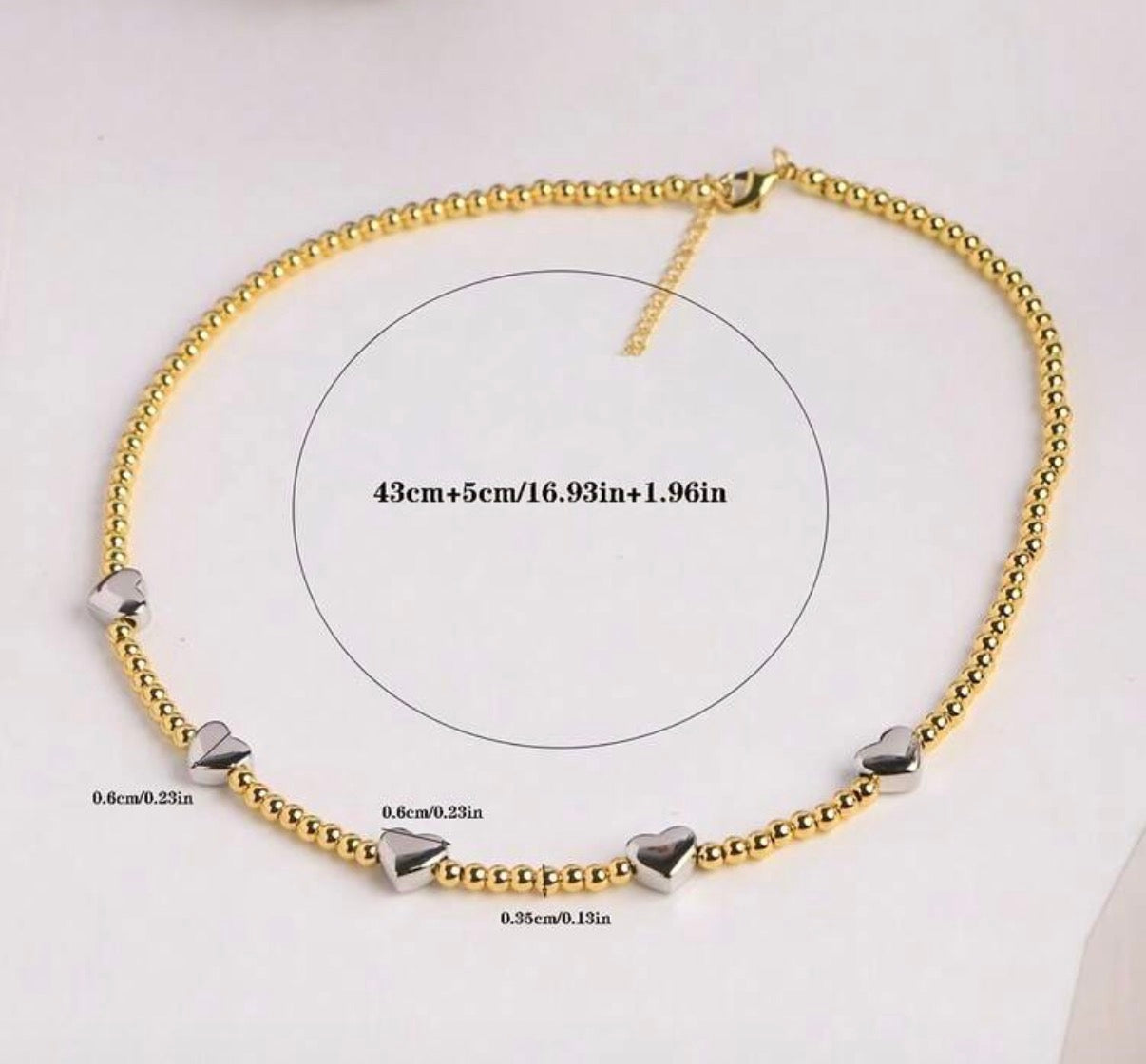 Delicate Two-Tone Gold Beaded Necklace with Silver Heart Accents