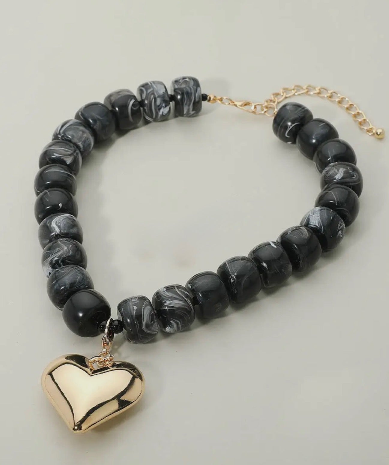 Black Marbled Bead Necklace with Gold Puffy Heart Pendant