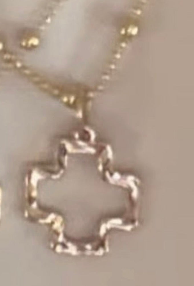 Gold Square Open Cross Pendant on a Gold Satellite Chain.
