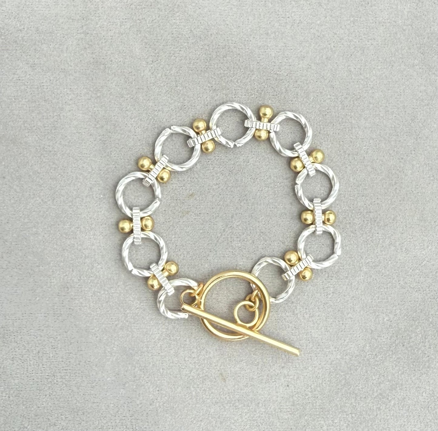 Two-Tone Toggle Chain Bracelet - Matte Silver with Gold Accents.