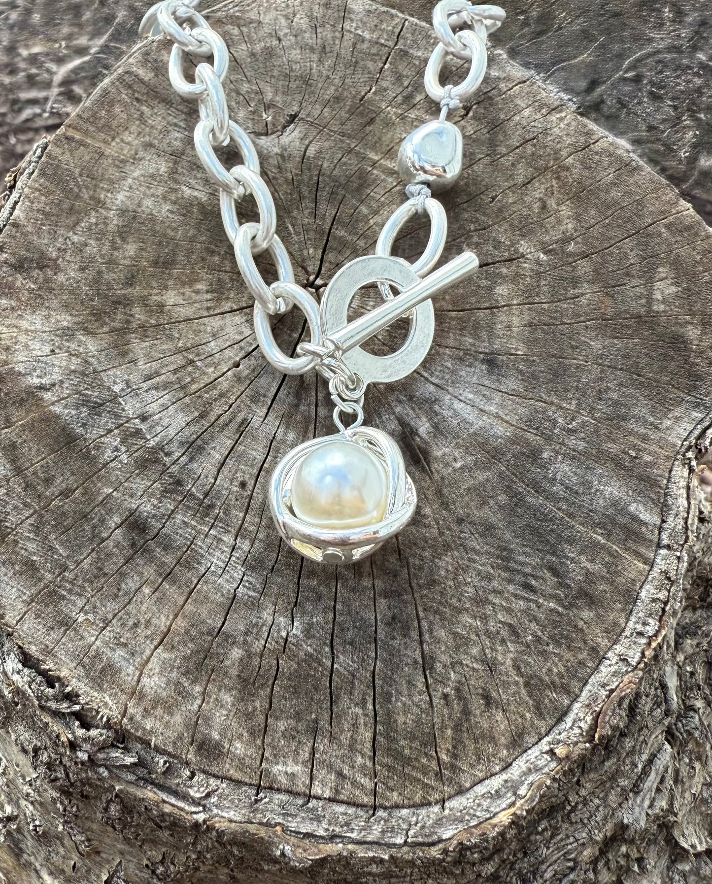 Silver chain-link Toggle Necklace with a Pearl Ball Pendant.