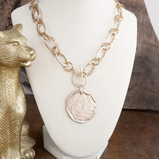 Worn Gold Toggle Statement Necklace with Hammered Disk Pendant