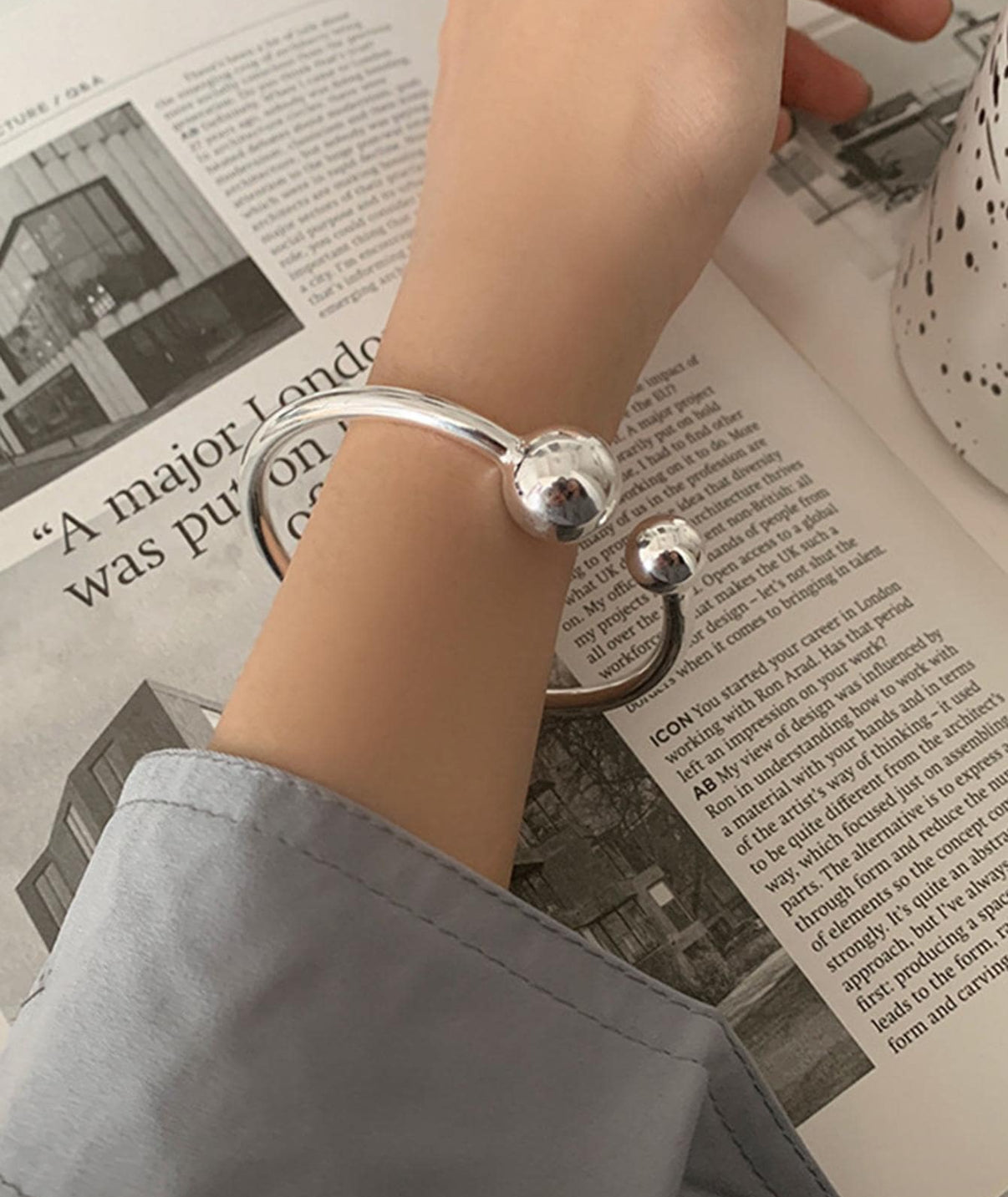Silver Steel Bangle Bracelet with Ball Accents.