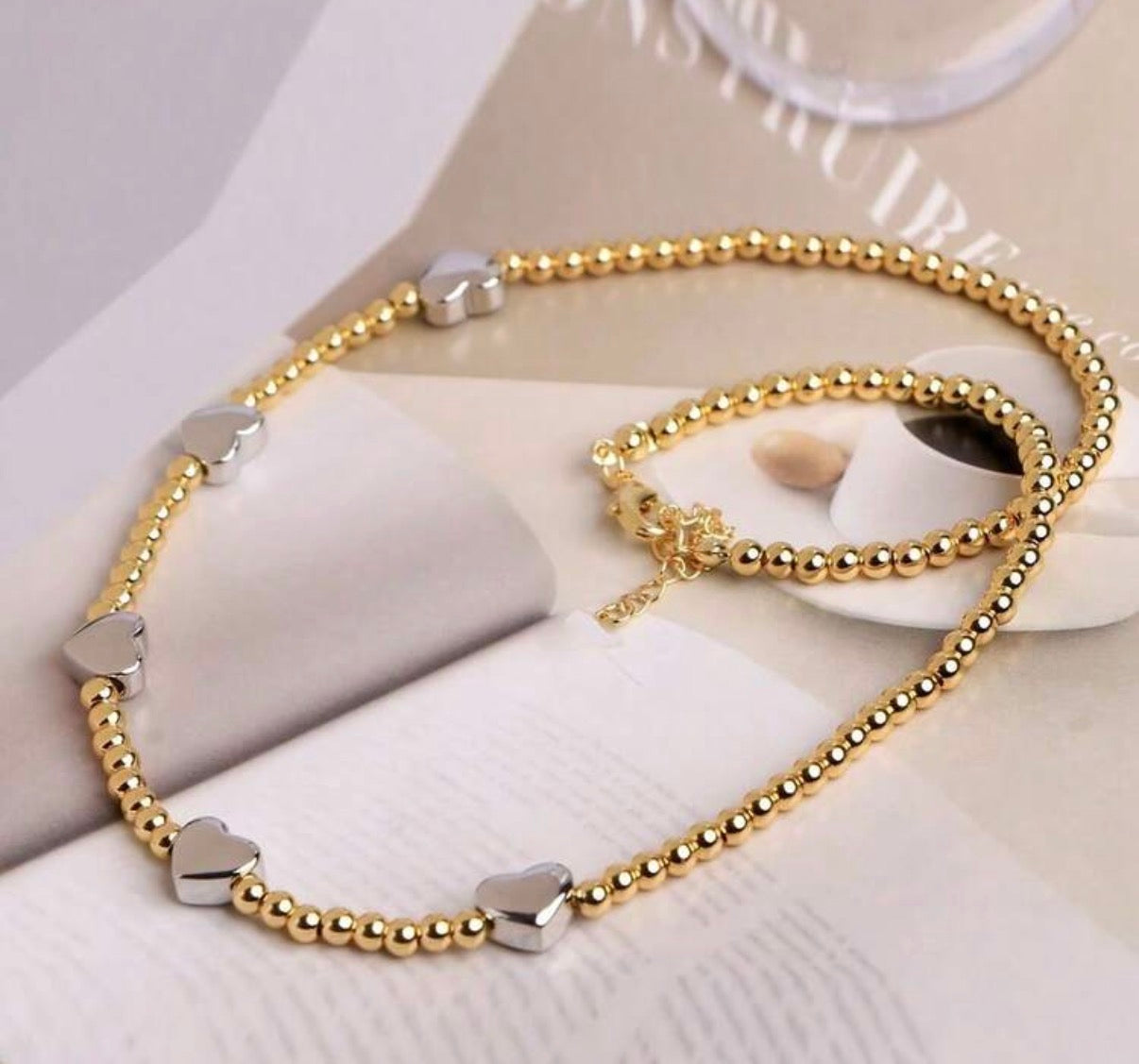 Delicate Two-Tone Gold Beaded Necklace with Silver Heart Accents