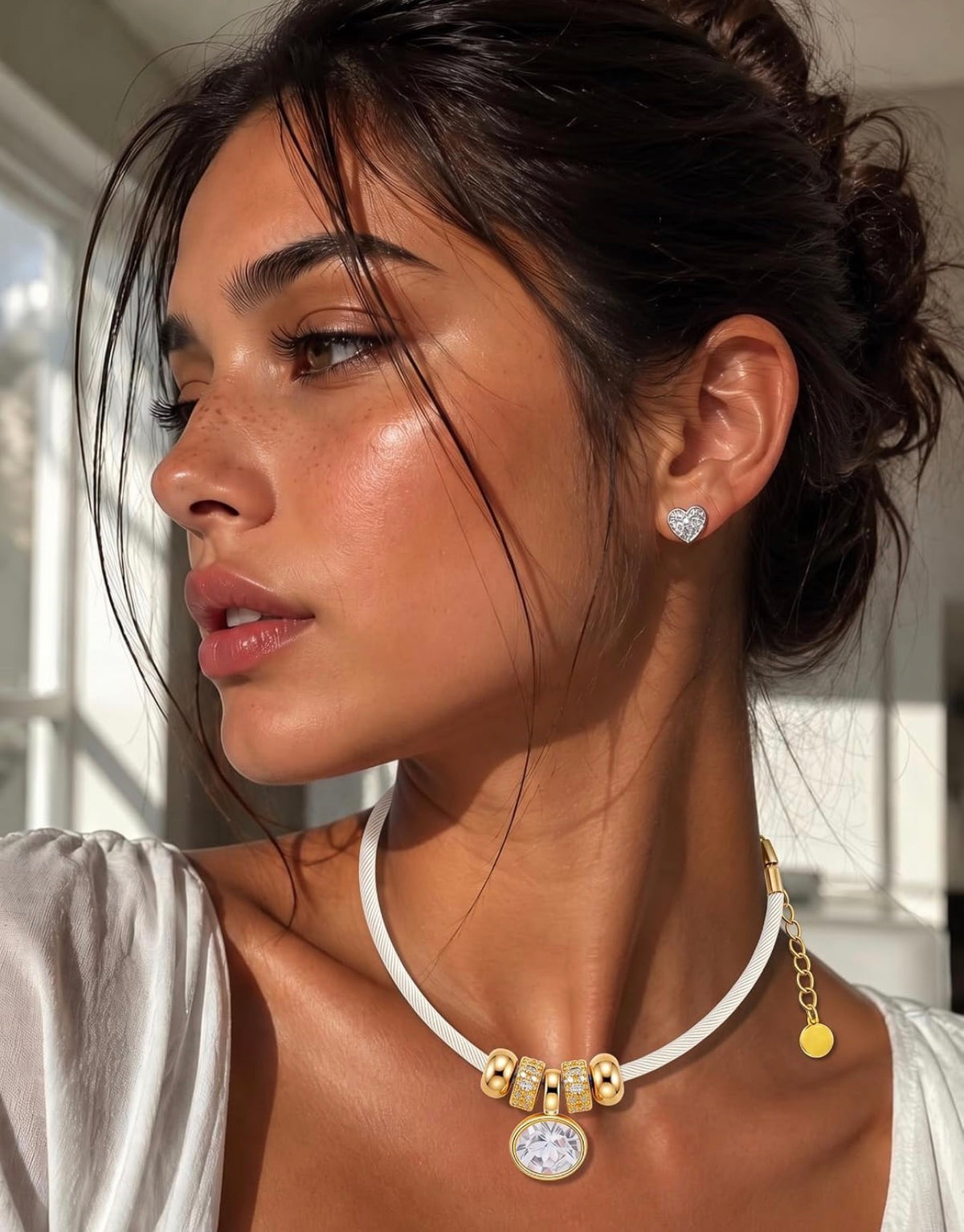 Gold Oval Crystal & Gold Charms on a White/Light Cream Satin Rope Necklace.