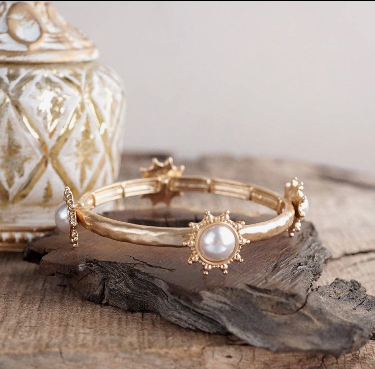 Suncrest Glow - Gold Hammered Stretch Bangle Bracelet with Pearl Suncrest Accents.
