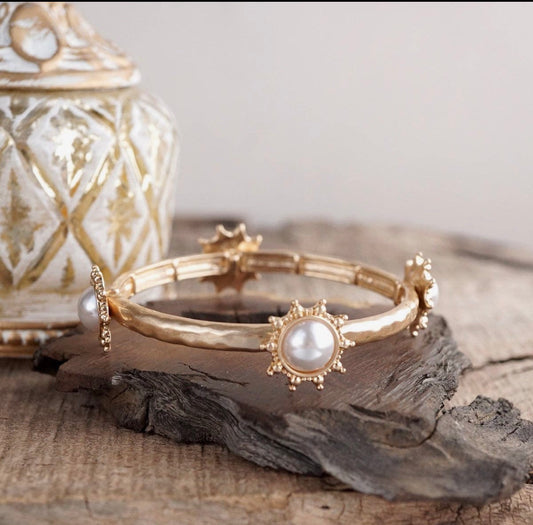 Suncrest Glow - Gold Hammered Stretch Bangle Bracelet with Pearl Suncrest Accents.