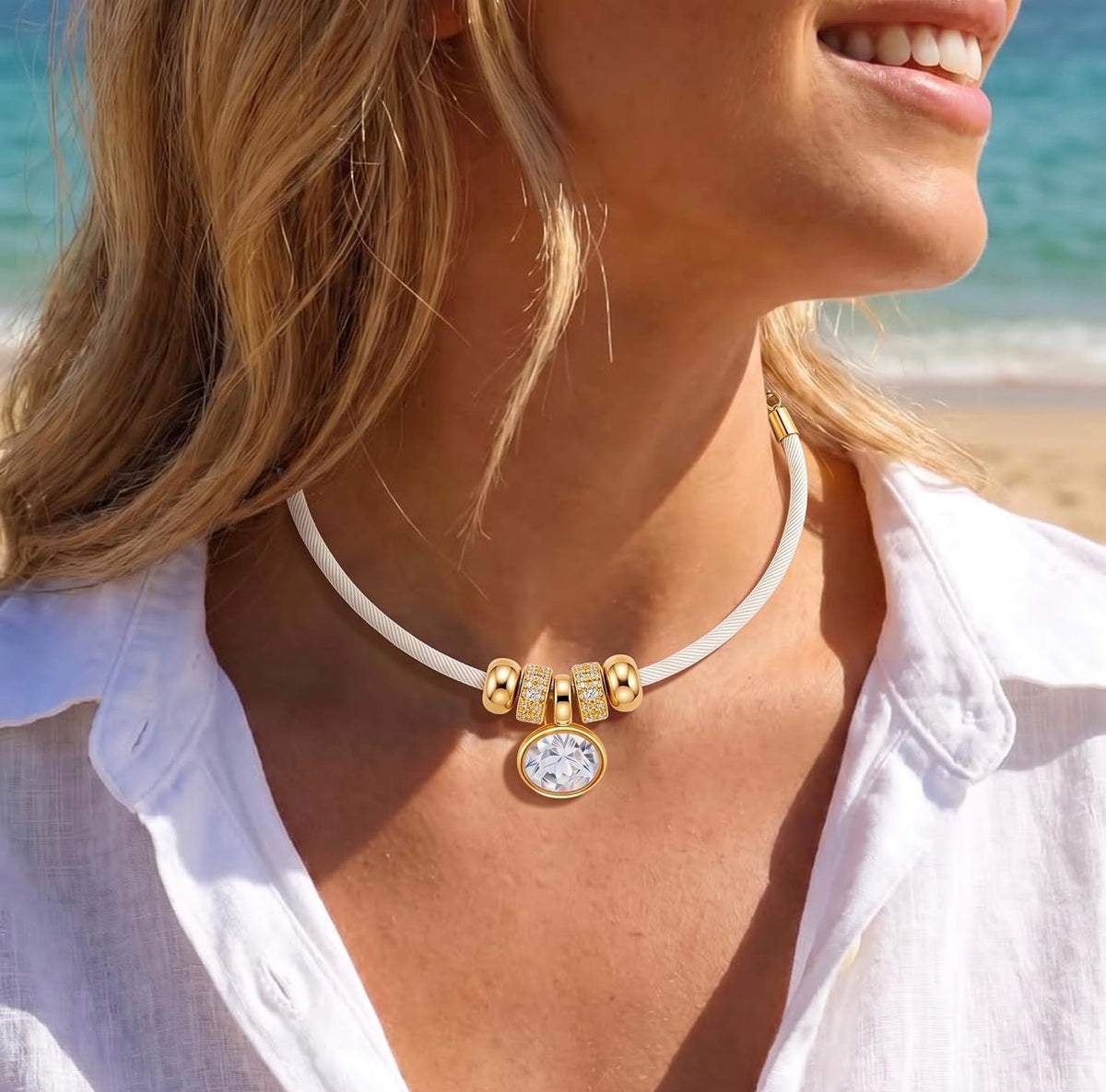 Gold Oval Crystal & Gold Charms on a White/Light Cream Satin Rope Necklace.