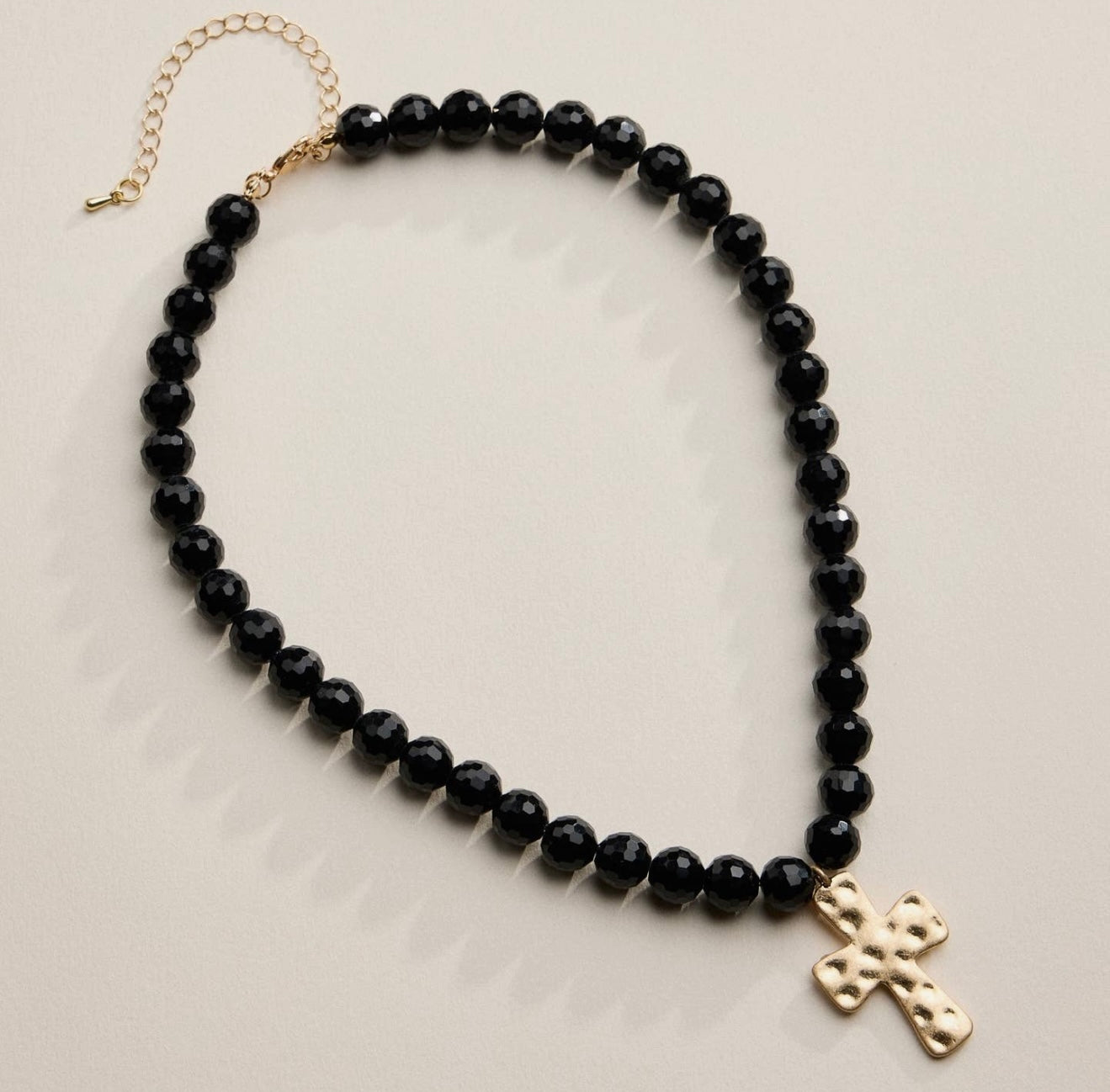 Black Beaded Necklace with Gold Hammered Cross