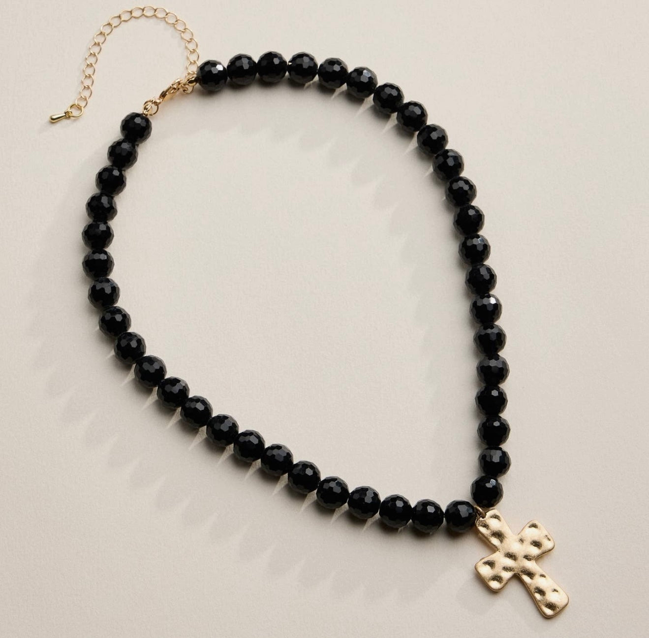 Black Faceted Beaded Necklace with Hammered Cross
Pendant