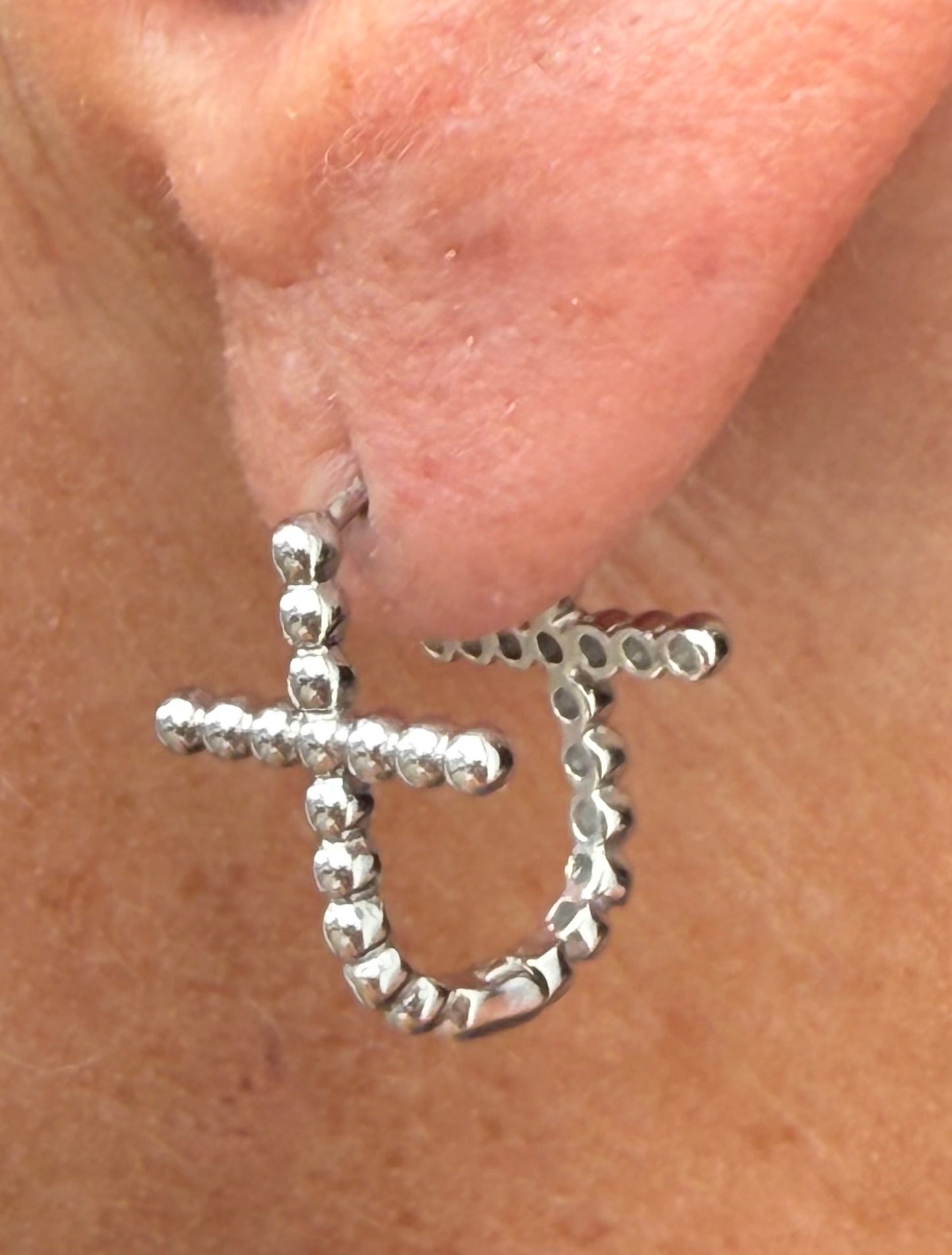 Double-Sided Silver Cross Huggie Hoop Earring.