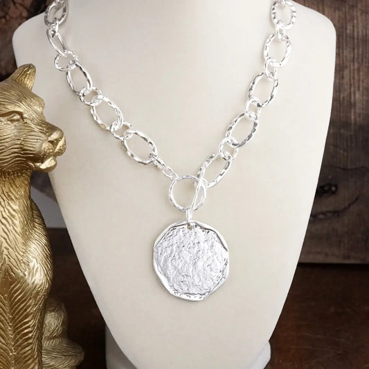 Worn Silver Toggle Statement Necklace with Hammered Disc Pendant
